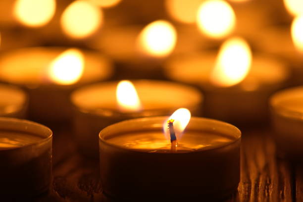 istock Many burning candles with shallow depth of field 1286197650