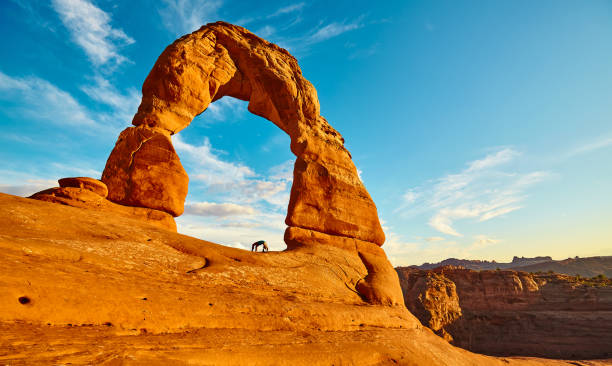 Panoramic view of the iconic Delicate Arch at sunset, Utah, USA. Panoramic view of the iconic Delicate Arch at sunset, Arches National Park, Utah, USA. delicate arch stock pictures, royalty-free photos & images