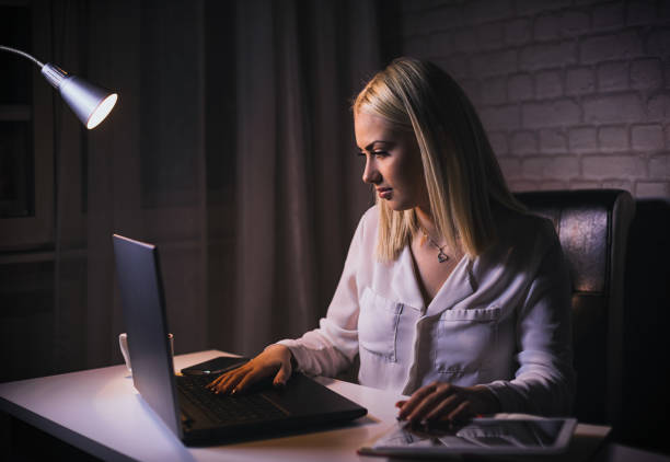 istock Young beautiful freelancer woman working from home late at night 1286200500