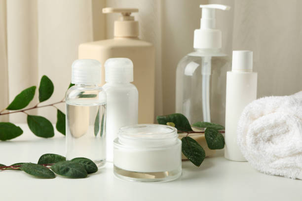 istock Spa cosmetic products and leaves on white table 1286201860
