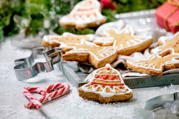 istock Christmas gingerbread cookies with icing ornate. Xmas decorations, white background. 1286202089