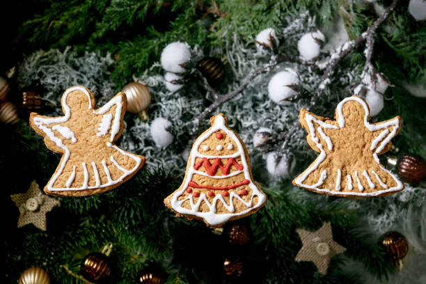 istock Christmas gingerbread cookies with icing ornate. Xmas decorations, dark background. Top view 1286202094