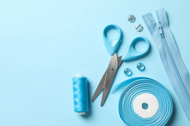 istock Blue sewing supplies on blue background, top view 1286202453