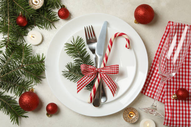 istock Concept of New year table setting with candles on white table 1286203812