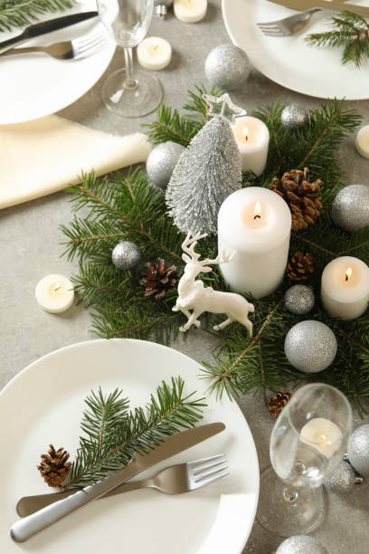 istock Concept of romantic New year table setting on gray table 1286204226