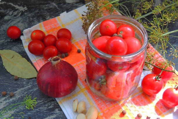 istock preparation for canning tomato, spices, cherry 1286206476