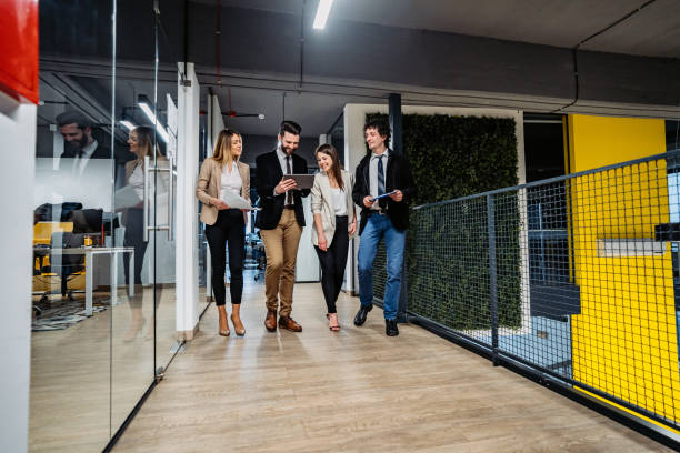 istock Businesspeople having a meeting in hallway 1286207830
