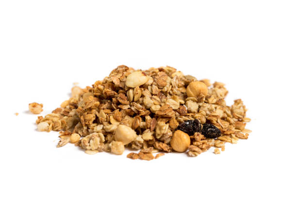 istock pile of Granola isolated on white background. 1286215175