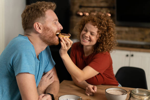 istock Happy young couple eating breakfast together. 1286215283