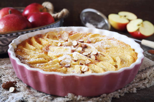 istock French cuisine. Red apple clafoutis, almonds and powdered sugars dressing 1286215819