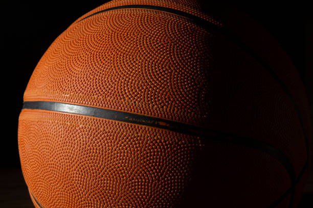 istock Basketball ball in a dark background 1286216360