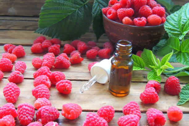 istock essential oil and raspberries 1286217266