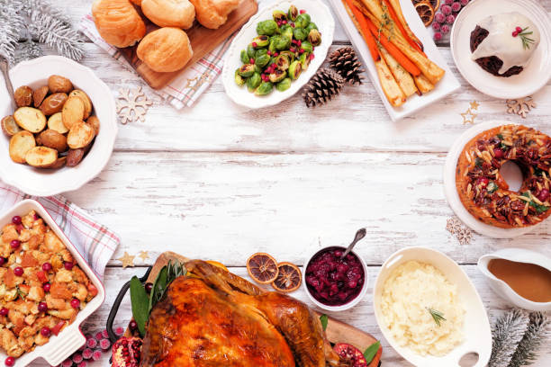 istock Traditional Christmas turkey dinner. Top view frame on a rustic white wood background with copy space. 1286217437