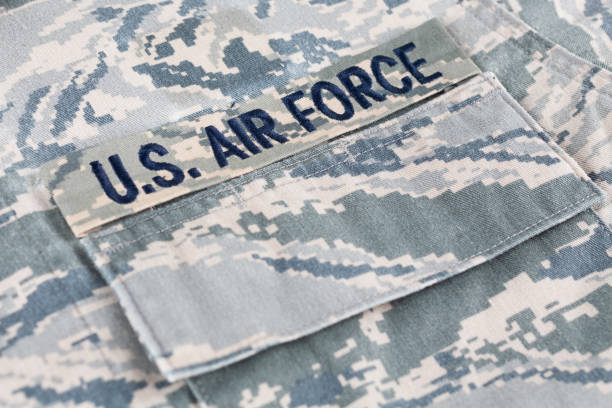US AIR FORCE branch tape on digital tiger-stripe pattern Airman Battle Uniform (ABU) US AIR FORCE branch tape on digital tiger-stripe pattern Airman Battle Uniform (ABU) background armed forces rank photos stock pictures, royalty-free photos & images