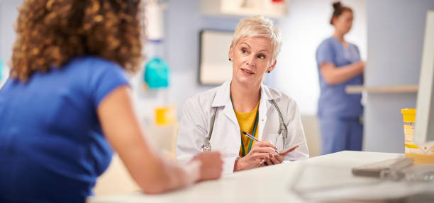 istock female doctor writing prescription 1286223533