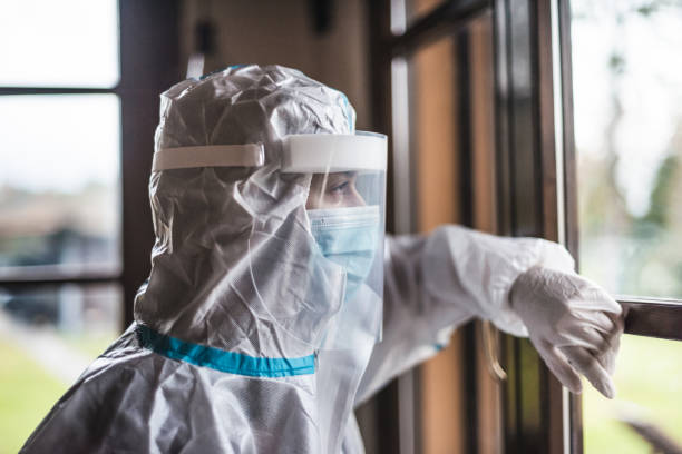 istock virologist at the window looking away 1286224179
