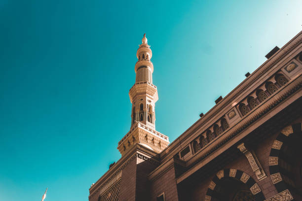 tower of nabawi mosque medina, saudi arabia - ancient arabic style arch architecture imagens e fotografias de stock