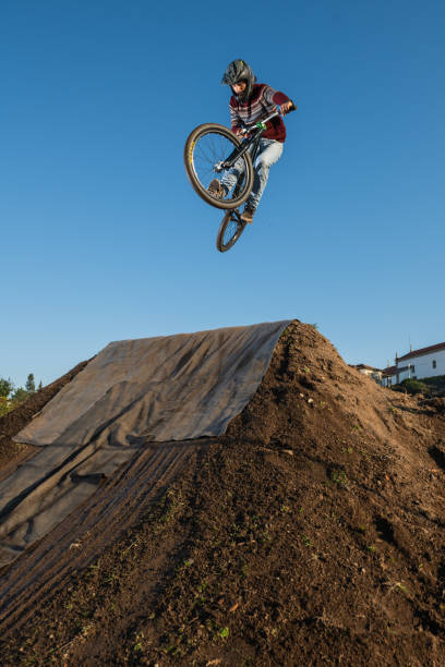 istock MTB Bike jump over a dirt trail 1286225401