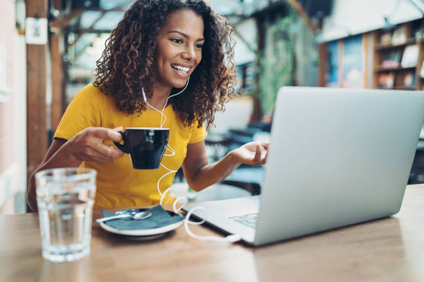 istock Young woman talking and drinking coffee during a video conference 1286225506