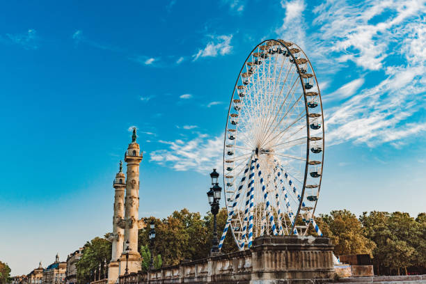 La Grande Roue des Quinconces, the Ferris Wheel of Bordeaux, France La Grande Roue des Quinconces, the Ferris Wheel of Bordeaux, France – empty during Coronavirus in Summer 2020 and the stay at home order, lockdown – free access walking point of view stock pictures, royalty-free photos & images