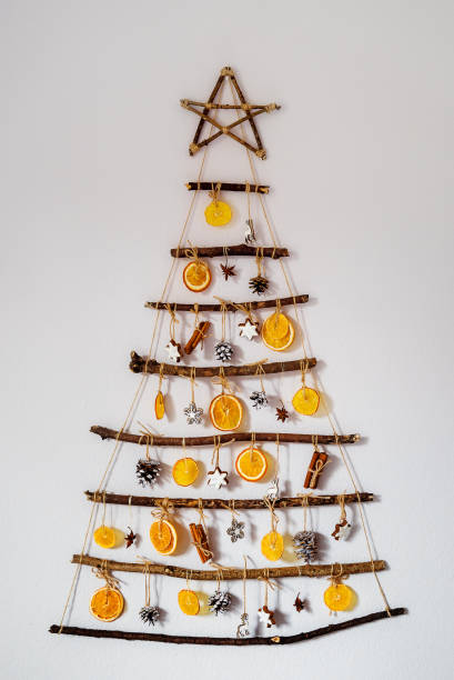 Handmade craft Christmas tree from sticks and natural materials. Sustainable Christmas, zero waste, plastic free, eco friendly Handmade craft Christmas tree from sticks and natural materials. Sustainable Christmas, zero waste, plastic free, eco friendly plastic free photos stock pictures, royalty-free photos & images