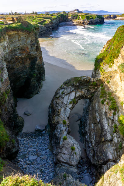 istock warm golden evening on a sandy beach with jagged and rugged cliffs 1286229788