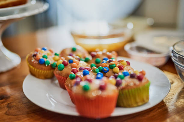 Shot of a plate of delicious cupcakes on a plate in a kitchen