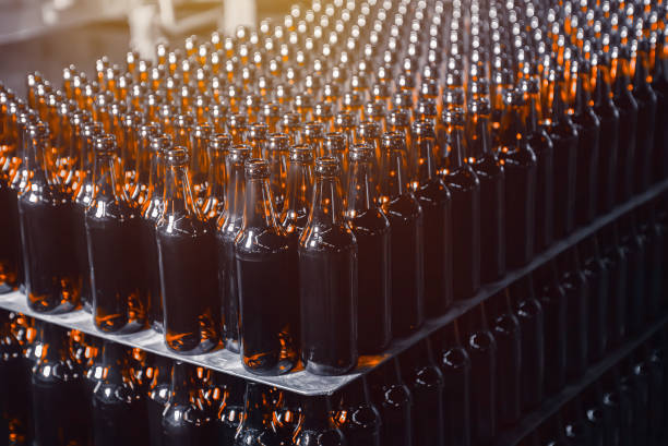 istock Rows of brown glass beer bottles on the stack 1286242804