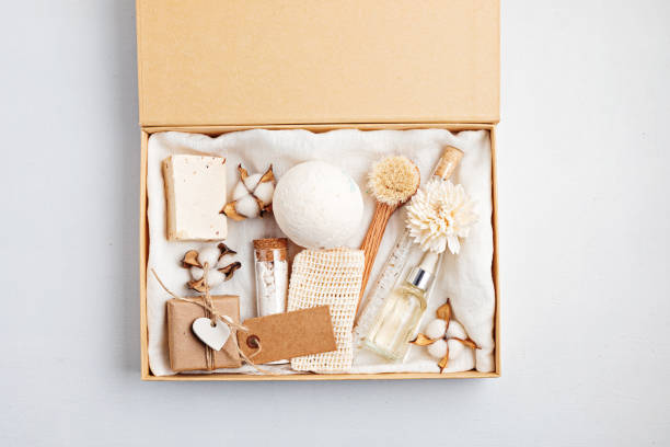 Preparing self care package, seasonal gift box with plastic free zero waste cosmetics products. Personalized eco friendly basket for family and friends for thankgiving, christmas, mothers day