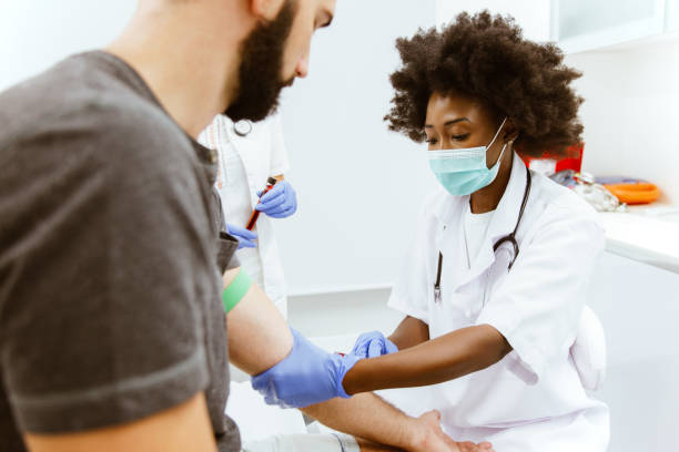 istock Female doctor with syringe is taking blood for test 1286244822