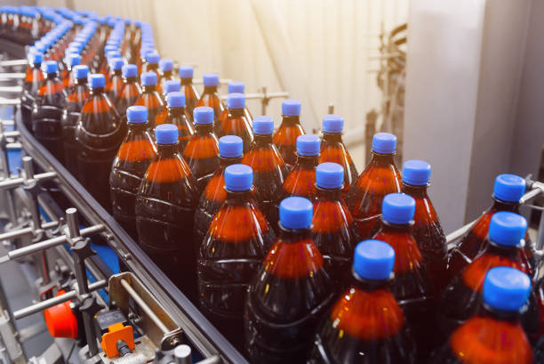 istock Plastic bottles with beer on a conveyor belt. Industrial beer production 1286245717