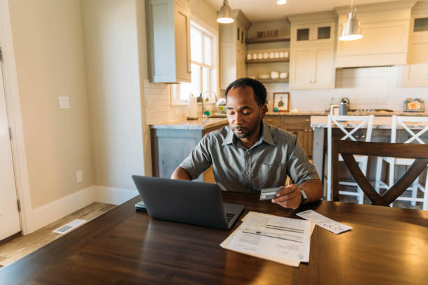istock Man Paying Bills and Banking Online 1286249353