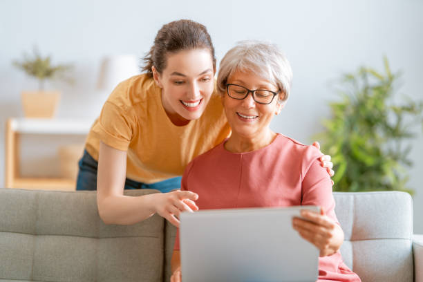 istock Young and senior women are using laptop 1286251417