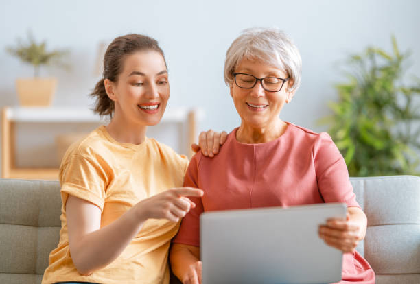 istock Young and senior women are using laptop 1286251420