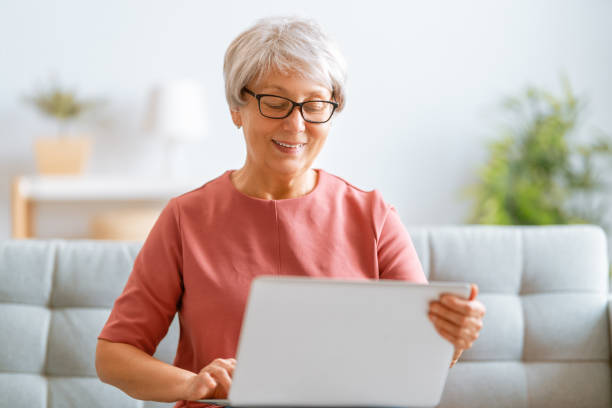 istock senior woman is using laptop 1286251429