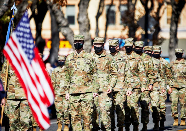 US Army particpants marching in Veteran's Day Parade Prescott, Arizona, USA, - November 11, 2020: US Army participants in uniform wearing face masks marching in the Prescott, Arizona Veteran's Day Parade us air force photos stock pictures, royalty-free photos & images