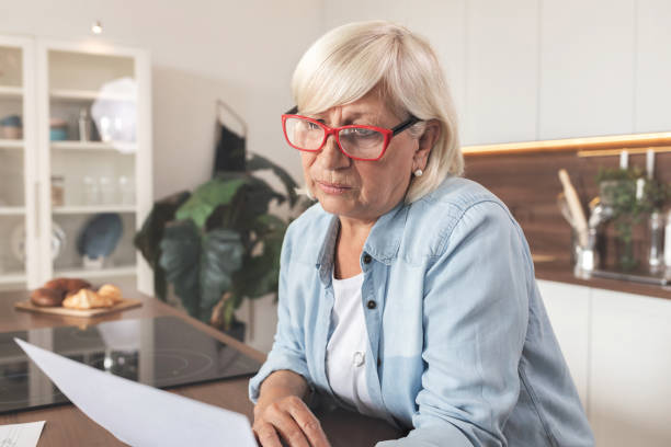 istock Elderly woman is desperate, has financial problems and high electricity bills. 1286261642