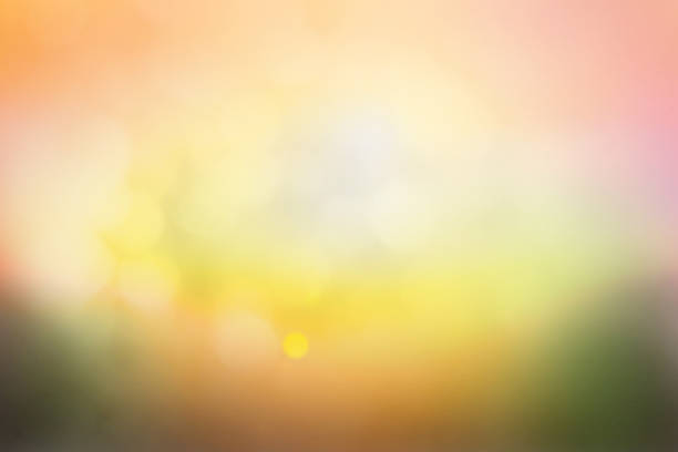 istock Hope concept; Abstract blurred sunrise background blurring warm colors calm bright sunlight. Sky effect gradient white sun at color orange light yellow soft flare patterns blur plain morning summer. 1286261729