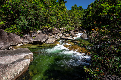 Cairns, Australia - September 11, 2020: A popular swimming hole just outside of Cairns, Babinda Boulders is most famous for its unique rock formations.