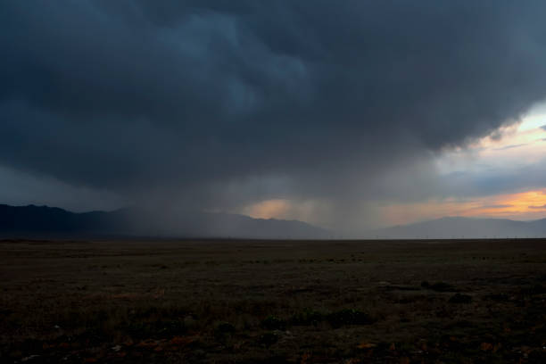 istock Kazakhstan steppe in evening time with rain clouds. Clouds background. Beautiful natural wallpaper. 1286264284