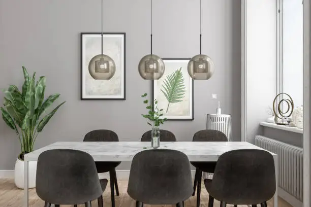 Photo of Modern Dining Room With Marble Dining Table, Pendant lights, Plants And Posters