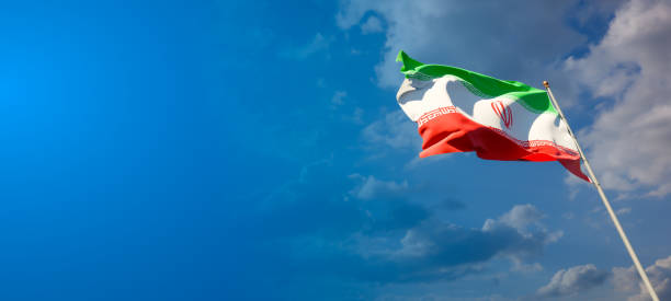 istock Iran national flag with blank text space on wide background. 1286267285