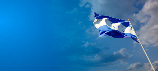 istock Honduras national flag with blank text space on wide background. 1286267336
