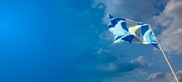 istock Guatemala national flag with blank text space on wide background. 1286267337