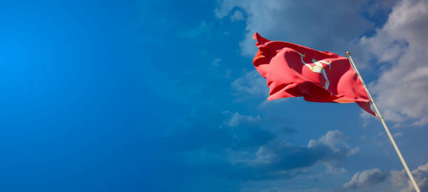 istock Isle of Mann national flag with blank text space on wide background. 1286267343