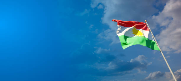 Beautiful national state flag of Kurdistan with blank space on wide background with place for text 3D artwork.