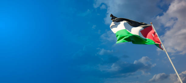 istock Jordan national flag with blank text space on wide background. 1286268053
