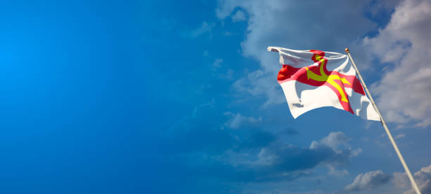 istock Guernsey national flag with blank text space on wide background. 1286268149