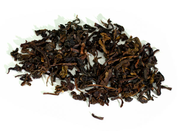 istock Dry tea leaves on a white background 1286269288