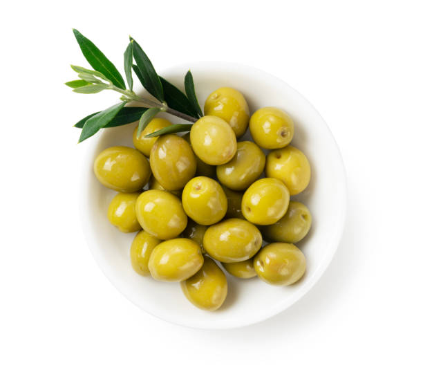 istock Salted olives and olive branches placed on a white background 1286269545